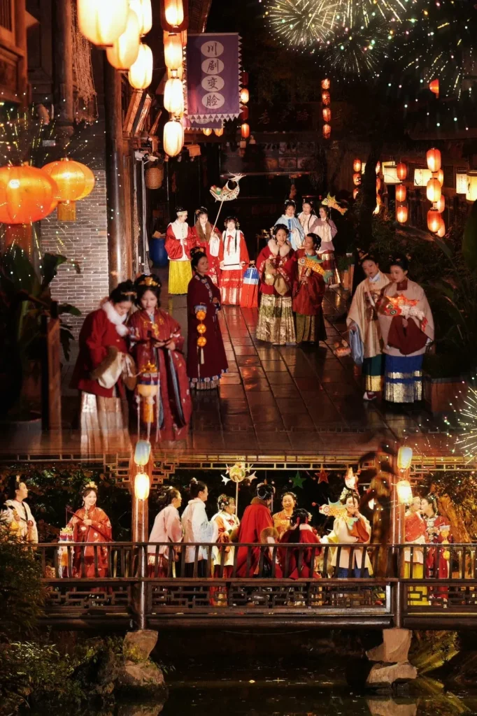 Two split images. The top image shows a street scene at night with many people in traditional Tang Dynasty Hanfu clothing. Ornate lanterns hang overhead and fireworks are visible in the sky. The bottom image shows a similar scene with people in Hanfu on a wooden bridge over water, with more lanterns and fireworks.